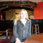 Upskirts peek at blonde Sophie in voyeur pussy shots in a bar