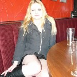 Upskirts peek at blonde Sophie in voyeur pussy shots in a bar